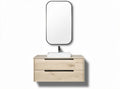 Wall-mounted wooden vanity with round mirror and stone vessel sink